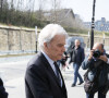 Bernard Tapie arrive au tribunal accompagné par son avocat Hervé Témime à Paris le 1er avril 2019.