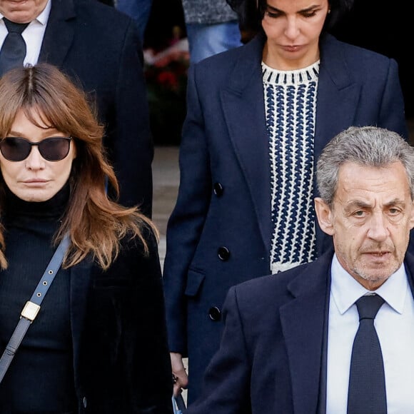 Carla Bruni, Nicolas Sarkozy - Sorties des obsèques de Jean-Pierre Pernaut en la Basilique Sainte-Clotilde à Paris le 9 mars 2022. © Cyril Moreau/Bestimage