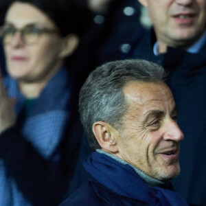 Nicolas Sarkozy, Karl Olive - People dans les tribunes du match de Ligue 1 Uber Eats "PSG contre Angers" (2-0) au Parc des Princes à Paris le 11 janvier 2023. © Cyril Moreau/Bestimage