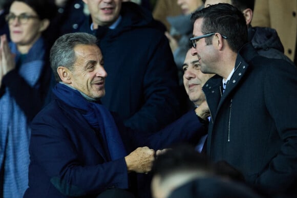 Nicolas Sarkozy, Karl Olive - People dans les tribunes du match de Ligue 1 Uber Eats "PSG contre Angers" (2-0) au Parc des Princes à Paris le 11 janvier 2023. © Cyril Moreau/Bestimage