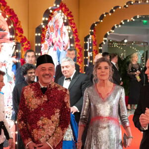 Christian Louboutin, la princesse Caroline de Hanovre, le prince Albert II de Monaco - Arrivée de la famille princière au Bal de la Rose 2023 sur le thème "Bollywood" à la salle des étoiles à Monaco le 25 mars 2023. © Olivier Huitel / Pool / Bestimage 