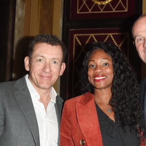 "La première fois que je l'ai vue, c'était en juillet 1994 dans un gymnase où il faisait une chaleur étouffante, racontait-il. Elle transpirait sous son masque".
Dany Boon, Laura Flessel-Colovic, Guy Forget - Dîner de la "Ryder Cup" au Fouquet's Barrière dans le cadre du mois du Golf Barrière, dîner confidentiel dans les salons de la Brasserie Fouquet's la veille du match des célébrités de la Ryder Cup à Paris le 24 septembre 2018.