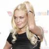 Quand Lindsay Lohan veut faire sa vampe devant les photographes, elle opte pour la main passée délicatement dans ses cheveux ! Pour être la plus sensuelle des starlettes, LiLo met le paquet...