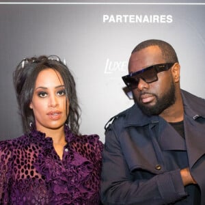 Exclusif - Le rappeur Gims (Maître Gims - Gandhi Djuna) et sa femme Demdem Djuna lors du photocall de la 14ème édition du Casa Fashion Show au Sofitel Casablanca Tour Blanche à Casablanca, Maroc, le 20 avril 2019. Sept ans déjà que le Casa Fashion Show promeut la femme marocaine citoyenne du monde. Devenu un rendez-vous incontournable et placé sous le Haut Patronage de Sa Majesté le Roi du Maroc, l'événement porté par K.Cheddadi et chorégraphié par H.Ghorab, se veut le reflet d'une société plurielle et avant-gardiste, jonglant avec brio entre ses racines orientales et sa culture occidentale. Une société solidaire également... L'événement soutenant depuis son lancement l'Association des Bonnes Œuvres du Coeur dont l'objectif est de redonner un souffle de vie et d'espoir aux bébés bleus. Le Casa Fashion Show dévoile au public marocain les collections Printemps/Eté 2019 des griffes les plus prestigieuses : de Etro à Oud Paris, en passant par Elisabetta Franchi, Pinko, Dice Kayek, Just Cavalli ou encore Orza Couture... Les créateurs marocains Lina Cahill et Sara Chraibi revisitent la robe du soir, avec cet oeil aiguisé et ce sens pointu du détail qui les caractérisent. Le talentueux couturier tunisien, Ali Karoui (souvent surnommé le nouveau Azzedine Alaia), est présent pour la seconde fois consécutive. Enfin, l'enseigne marocaine de luxe IO sera la chaussure officielle de l'événement et l'Oréal Paris, le partenaire coiffure et make up du show. © Philippe Doignon/Bestimage