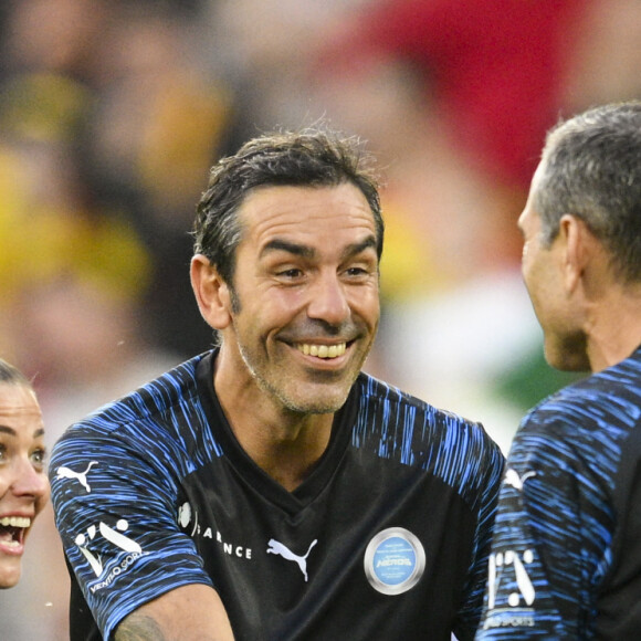 Laure Boulleau (UNICEF) / Robert Pires (UNICEF) / Pedro Miguel Pauleta (UNICEF) - 3ème édition de la rencontre de football caritative "Match des héros" entre le "RC Lens Légendes" et "L'équipe Unicef" au stade Bollaert-Delelis à Lens le 6 juin 2023. Le tout dans le but de récolter des fonds pour l’Unicef et la fondation Racing Cœur de Lens. 