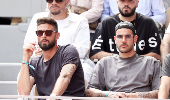 Olivier Giroud, Théo Hernandez - Célébrités en tribunes des Internationaux de France de tennis de Roland Garros 2023 à Paris le 11 juin 2023. © Jacovides-Moreau/Bestimage 