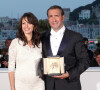 Jean Dujardin et Bérénice Bejo - Photocall de la remise des Palmes du 64e Festival de Cannes.