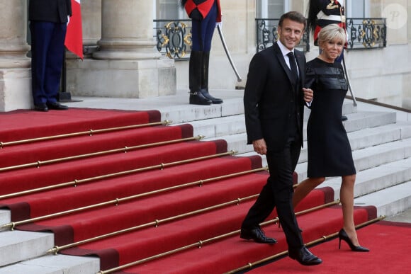 Le président français Emmanuel Macron et la première dame, Brigitte Macron lors d'un dîner officiel au palais de l'Élysée, en marge du sommet du nouveau pacte financier mondial, à Paris, le 22 juin 2023, au palais Brogniard, Paris. © Stéphane Lemouton / Bestimage 