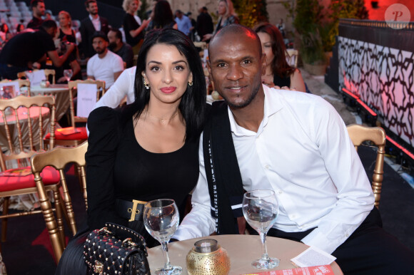 Suite au décès du jeune garçon de 17 ans lors d'un contrôle de police à Nanterre, l'ex femme d'Éric Abidal a pris la parole 
 
Exclusif - Eric Abidal et sa femme Hayet - Fête de clôture du 9ème festival "Marrakech du Rire 2018" au Palais Bahia de Marrakech au Maroc le 15 juin 2019. Monument majeur du patrimoine culturel marocain, le Palais Bahia est un ancien palais du XIXe siècle. Véritable chef-d'oeuvre de l'architecture marocaine, le palais - devenu musée - est l'un des principaux lieux touristiques du pays. Après avoir accueilli un dîner de prestige organisé par la maison de haute-couture Christian Dior en avril 2019, c'est la seconde fois seulement que le Palais Bahia ouvre ses portes à un événement culturel international majeur avec la soirée de clôture de la 9e édition du Festival Marrakech du Rire. © Rachid Bellak/Bestimage