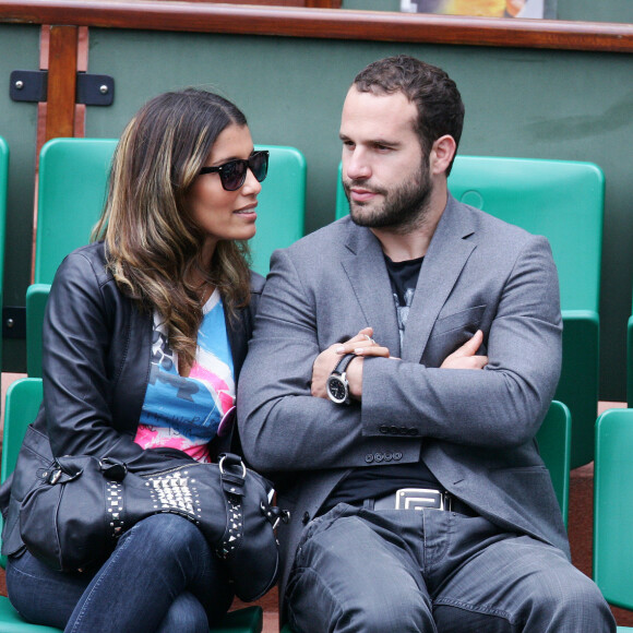 Ils sont en couple depuis leur rencontre en Afrique du Sud
Archives - Frédéric Michalak et sa compagne Cindy dans les tribunes du tournoi international de tennis Roland Garros à Paris. Le 31 mai 2010