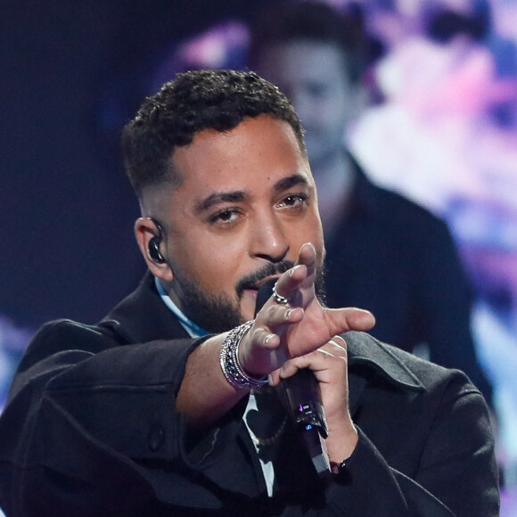 Le musicien fait aussi également partie du jury de l'émission The Voice Kids cette saison sur TF1
Exclusif - Slimane chante son tube "La recette" - Enregistrement de l'émission "Les 20 chansons préférées 2022", diffusée le 5 janvier 2023 sur M6 © Christophe Clovis / Bestimage É.Gossuin vous invite à un grand show musical inédit au coeur du Dôme de Paris. Grâce à un grand sondage IFOP, découvrez le classement des 20 chansons de l'année préférées des Français. 20 chansons qui sont déjà devenues des tubes incontournables et que vous avez le plus plébiscitées en 2022 ! Au programme de cette soirée évènement, des prestations live exclusives et de nombreuses images qui retraceront une année riche en tubes. Retrouvez toutes les stars et toutes les chansons qui ont marqué l'année musicale ! Alors, quelle chanson avez-vous élue comme étant votre chanson préférée de l'année ? 