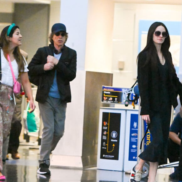 Exclusif - Rare apparition de Mick Jagger, sa compagne Melanie Hamrick et leur fils Deveraux à l'aéroport JFK de New York City, New York, Etats-Unis, le 15 juin 2023.