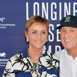 Exclusif - Yves Rénier et sa femme Karin - Photocall du déjeuner - Longines Paris Eiffel Jumping au Champ de Mars à Paris, le 5 juillet 2019. © Veeren Ramsamy/Bestimage