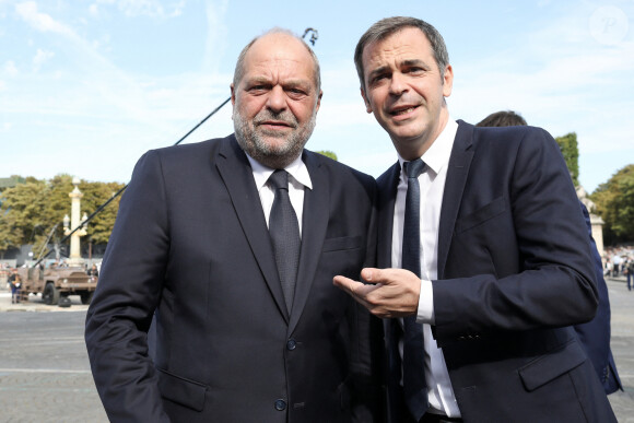 Le Porte-parole du gouvernement français, Olivier Véran et Eric Dupond-Moretti, ministre de la Justice, garde des Sceaux - Le président français assiste au défilé du 14 juillet 2022, place de la Concorde, Paris, © Stéphane Lemouton / Bestimage 