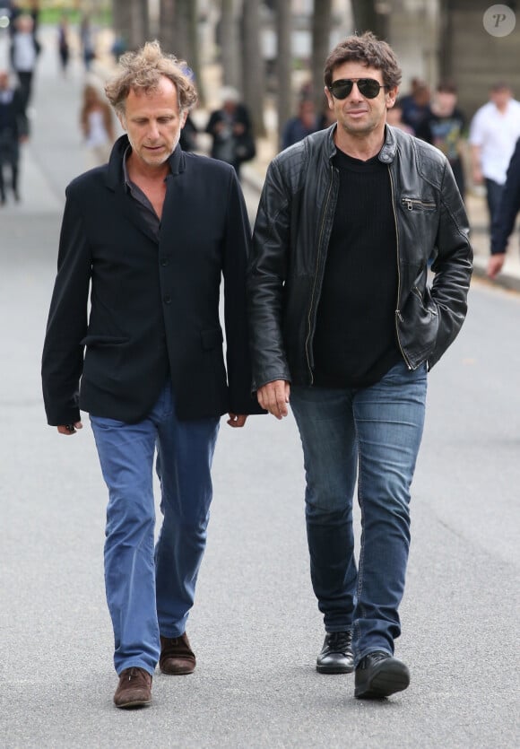Charles Berling et Patrick Bruel - Celebrites a la sortie des obseques de Valerie Benguigui au cimetiere du Montparnasse a Paris. Le 6 septembre 2013