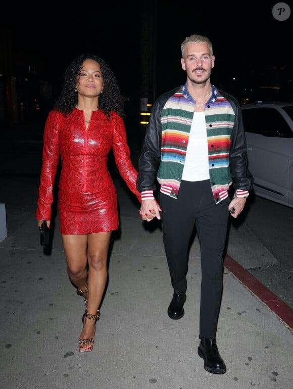 Christina Milian dîne dans un restaurant de Los Angeles avec son mari Matt Pokora dans une robe rouge.