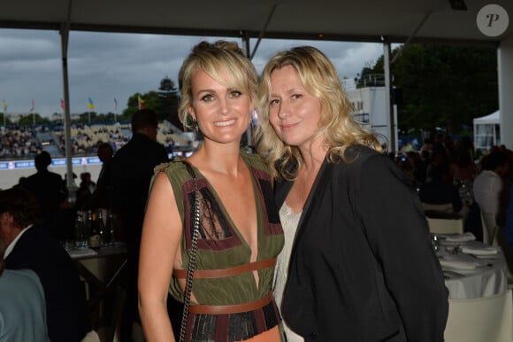 Laeticia Hallyday et Luana Belmondo - Soirée au profit de l'Association "La Bonne étoile" de Laeticia Hallyday lors du 3ème Longines Paris Eiffel Jumping à la plaine de Jeux de Bagatelle à Paris le 1er juillet 2016 dans le Pavillon Eiffel du Longines Paris Eiffel Jumping décoré par Luxury Living. © Olivier Borde / Veeren / Bestimage 