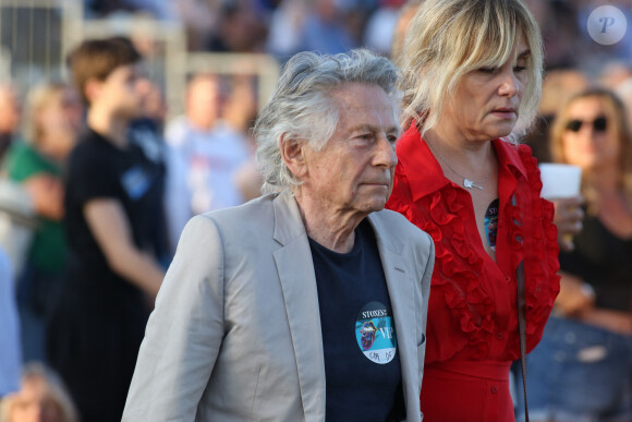 Roman Polanski et sa femme Emmanuelle Seigner - Les Rolling Stones en concert à l'hippodrome de Longchamp, dans le cadre de leur tournée anniversaire "Sixty", qui marque leurs 60 ans de carrière (1962-2022). Paris, le 23 juillet 2022. © Stéphane Vansteenkiste/Bestimage