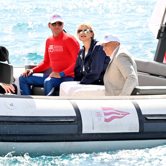 La princesse Charlene de Monaco a assisté à la descente en apnee de l'ancien champion du monde Pierre Frolla qui a recuperé le drapeau du grand prix de formule 1 de Monaco et le lui a remis, dans la baie de Monaco, le 22 mai 2024. La princesse accompagnée par son frère Gareth Wittstock qui a lui aussi plongé avec Pierre Frolla a signé le drapeau à damiers du Grand Prix de F1. L'opération Poseïdon en partenariat avec la Fondation Princesse Charlene va tendre à sensibiliser durant toute la période du Granc Prix, le public aux risques de noyades et aux gestes qui sauvent. © Bruno Bebert/Bestimage 