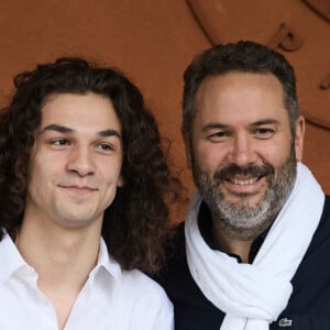 Noé Toussaint et son père Bruce Toussaint - Les célébrités au village lors des Internationaux de France de tennis de Roland Garros 2024 à Paris. Le 5 juin 2024. © Jacovides-Moreau/Bestimage 