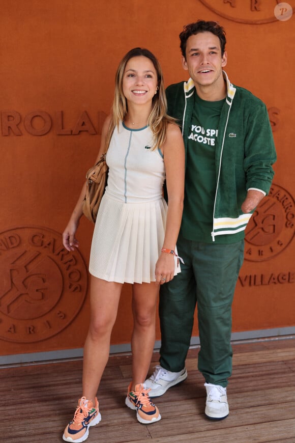 Théo Curin et sa compagne Marie-Camille Fabas - Célébrités au village lors des Internationaux de France de tennis de Roland Garros 2024 à Paris le 9 juin 2024.  Celebrities in the village during the 2024 Roland Garros French Open tennis tournament in Paris on June 9, 2024.