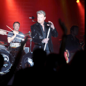 David Hallyday et Johnny Hallyday en concert au Sporting de Monaco pendant la tournée "Tour 66"