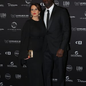 Omar Sy et sa femme Hélène au photocall de la 11ème cérémonie des Globes de Cristal au Lido à Paris le 30 janvier 2017