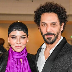 Tomer Sisley et Sandra Zeitoun assistent au défilé Imane Ayissi Haute Couture Printemps/Été 2024 dans le cadre de la semaine de la mode à Paris le 22 janvier 2024. Shootpix/ABACAPRESS.COM