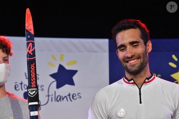 Et membre de la commission des athlètes du Comité international olympique (CIO)
Martin Fourcade et ses skis - Vente aux enchères "Légende du sport" au profit de l'association Les Etoiles Filantes (association qui aide les familles dont un enfant est atteint du gliome infiltrant du tronc cérébral), dont le parrain de cette année est M.Fourcade, aux Puces du Canal à Lyon. Le 18 septembre 2020 320 000 euros ont été récoltés. Le maillot de Kylian Mbappé a été adjugé à 160 000 euros. © Frederic Chambert / Panoramic / Bestimage