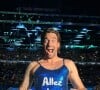 Camille Lacourt en robe à paillettes sur France 2 suite à un pari de Laure Manaudou. Instagram le 2 août 2024.