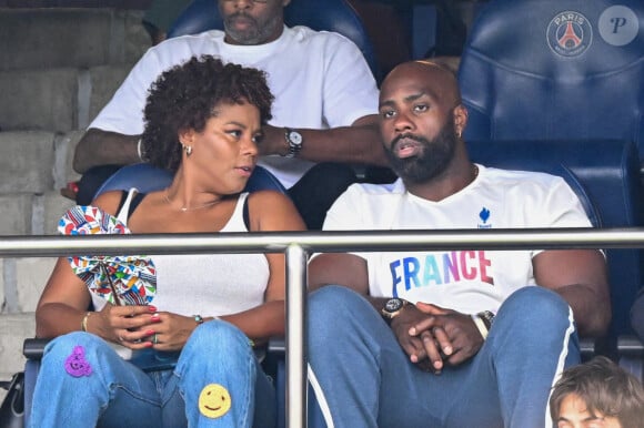 Teddy Riner et sa femme Luthna Plocus en tribunes pendant l'épreuve finale de football opposant la France à l'Espagne lors des Jeux Olympiques de Paris 2024 (JO) au Parc des Princes, à Paris, France, le 9 août 2024. © Jacovides-Perusseau/Bestimage 