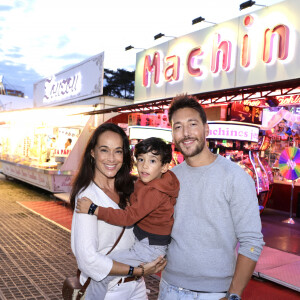 Karine Lima avec son compagnon Paul et leur fils Liam lors de L'inauguration de la fête à NeuNeu dans le Bois de Boulogne à Paris, France, le 6 septembre 2024. © Cédric Perrin/Bestimage