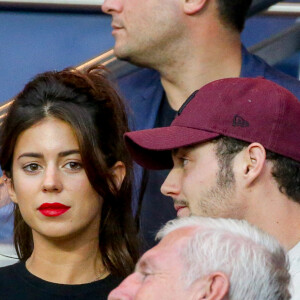 Louis Sarkozy et sa femme Natali Husic dans les tribunes lors du match de Ligue 1, Paris Saint-Germain (PSG) vs Toulouse FC (TFC) au Parc des Princes à Paris, France, le 20 août 2017. 