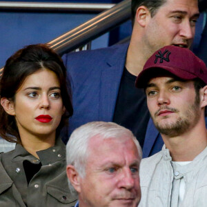 Louis Sarkozy et sa femme Natali Husic dans les tribunes lors du match de Ligue 1, Paris Saint-Germain (PSG) vs Toulouse FC (TFC) au Parc des Princes à Paris, France, le 20 août 2017.