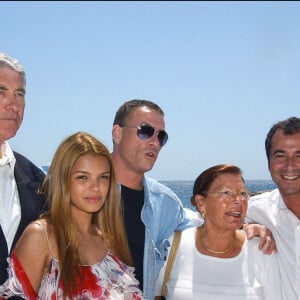 Arnal-Hahn-Nebinger/ABACA. 45625-3. Cannes-France, 15/05/2003. L'acteur belge Jean-Claude Van Damme entouré de ses parents et des présentateurs français Bernard Montiel et Severine Ferrer lors d'une soirée de charité pour le Planet Hollywood sur la plage du Majestic.