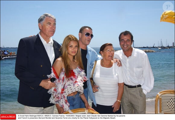 Arnal-Hahn-Nebinger/ABACA. 45625-3. Cannes-France, 15/05/2003. L'acteur belge Jean-Claude Van Damme entouré de ses parents et des présentateurs français Bernard Montiel et Severine Ferrer lors d'une soirée de charité pour le Planet Hollywood sur la plage du Majestic.