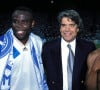 "Basile Boli te rend visite. Depuis toujours, il vient voir 'le boss'", écrit Marie Griessinger-Tapie

Archives - Basile Boli, Bernard Tapie et Abedi Pelé - © Panoramic/Bestimage