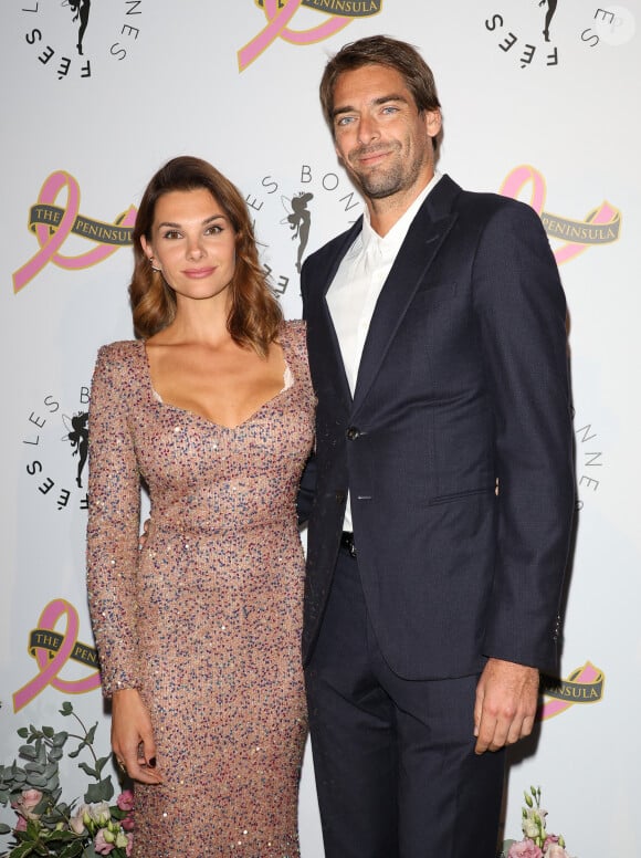 Que son père a accueilli avec sa compagne Alice Detollenaere
Camille Lacourt et sa compagne Alice Detollenaere (Miss Bourgogne 2010) - Photocall du 4ème gala de charité de l'association "Les Bonnes Fées" à l'occasion de la campagne mondiale "Octobre Rose" à l'hôtel Peninsula, Paris le 5 octobre 2023. © Coadic Guirec/Bestimage