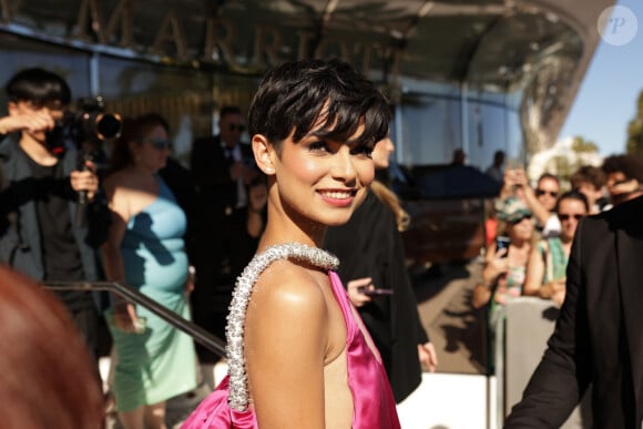 Cannes, FRANCE - Ève Gilles rocks the red carpet in an eye-catching, huge pink satin gown from Stephane Rolland's Spring 2020 Couture collection. Pictured: Ève Gilles