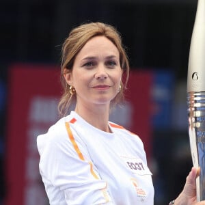 Nathalie Péchalat en couple avec un grand sportif
Nathalie Pechalat lors du relais de la Flamme Olympique au Club France à Paris.