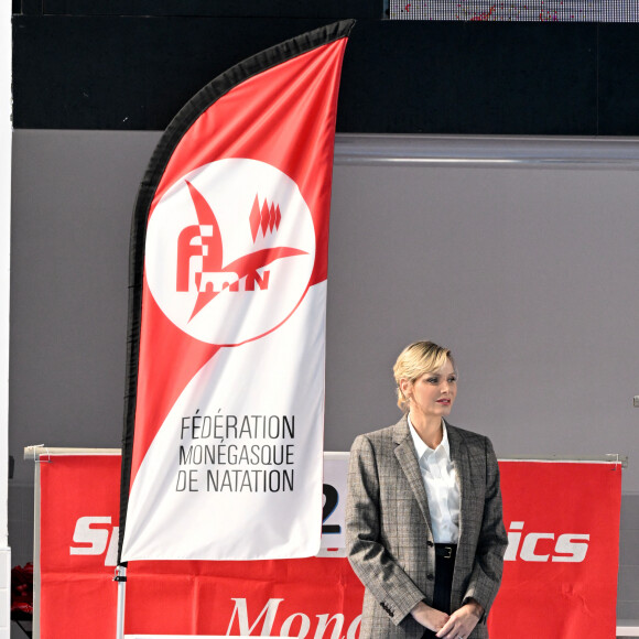 Exclusif - No Web - No Tabloids - La princesse Charlene de Monaco a présidé la cérémonie d'ouverture du meeting européen de natation « Princesse Charlène » organisé par Special Olympics Monaco au Centre Nautique Albert II à Monaco. Le 26 octobre 2024. Plus de 200 athlètes en provenance d’Allemagne, d’Irlande, de Slovénie, de Chypre ou encore de Gibraltar ont fait le déplacement pour ce meeting européen de natation, placé sous le haut patronage de la princesse Charlène. C’est la deuxième fois que Special Olympics Monaco organise un évènement d’une telle ampleur destiné aux sportifs déficients intellectuels. Toutes les délégations ont défilé devant un public nombreux et ont pu assister au discours officiel de P.Klaveren, le président de Special Olympics Monaco, puis à un spectacle de danse synchronisée, un live du chanteur T.James, tout droit sorti de The Voice saison 9, ainsi qu'un concert de l'orchestre des carabiniers du prince. C'est la princesse qui a déclaré ouvert le meeting de natation. © Bruno Bebert / Bestimage  Exclusive - No Web - No Tabloids - Princess Charlene of Monaco presided the opening ceremony of the European swimming meeting «Princesse Charlène» organized by Special Olympics Monaco at the Centre Nautique Albert II in Monaco. On October 26th 2024. 