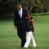 Barack Obama, sa femme Michelle, et leurs filles Malia et Sasha arrivent à la Maison Blanche