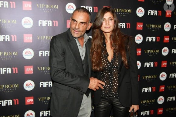 Christian Audigier et sa nouvelle compagne Isha, à la soirée FIFA au VIP Room à Paris, le 11 octobre
