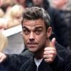 Robbie Williams et Take That quittent les studios de Radio 1 à Londres, le 27 octobre 2010