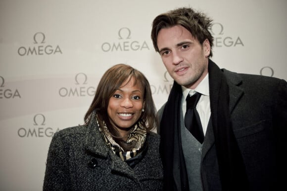 Laura Flessel et Romain Collinet lors de la soirée du lancement de la collection Ladymatic de la maison Omega, dans la boutique des Champs-Elysées le 7 décembre 2010