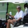Barack Obama et ses amis Bobby Titcomb et Marty Nesbitt en plein golf, country Club de Kailua, le 28 décembre 2010