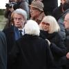 Alain Delon et Mireille Darc quittant l'église Saint-Roch où se sont déroulées les obsèques d'Annie Girardot le 4 mars 2011 à Paris