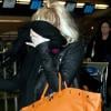 Lindsay Lohan se rend à l'aéroport de New York's JFK International Airport le 6 avril 2011 afin de se rendre à Los Angeles