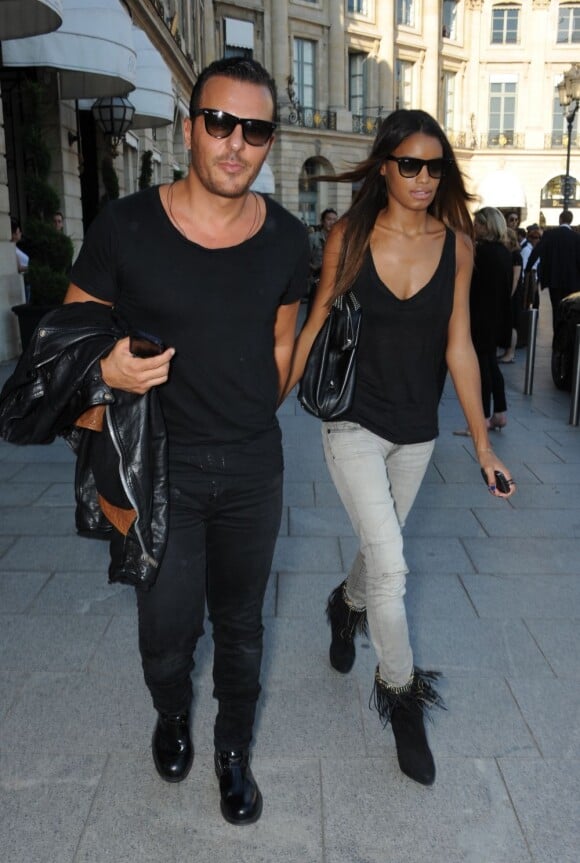 Jean-Roch avec sa compagne arrive au défilé Barbara Bui lors de la Fashion Week parisienne le 29 septembre 2011