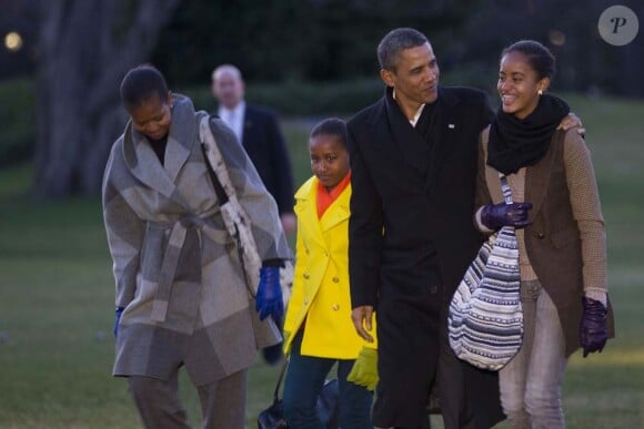 Michelle et Barack Obama, leur filles Sasha et Malia, à Washington le 3 janvier 2012.